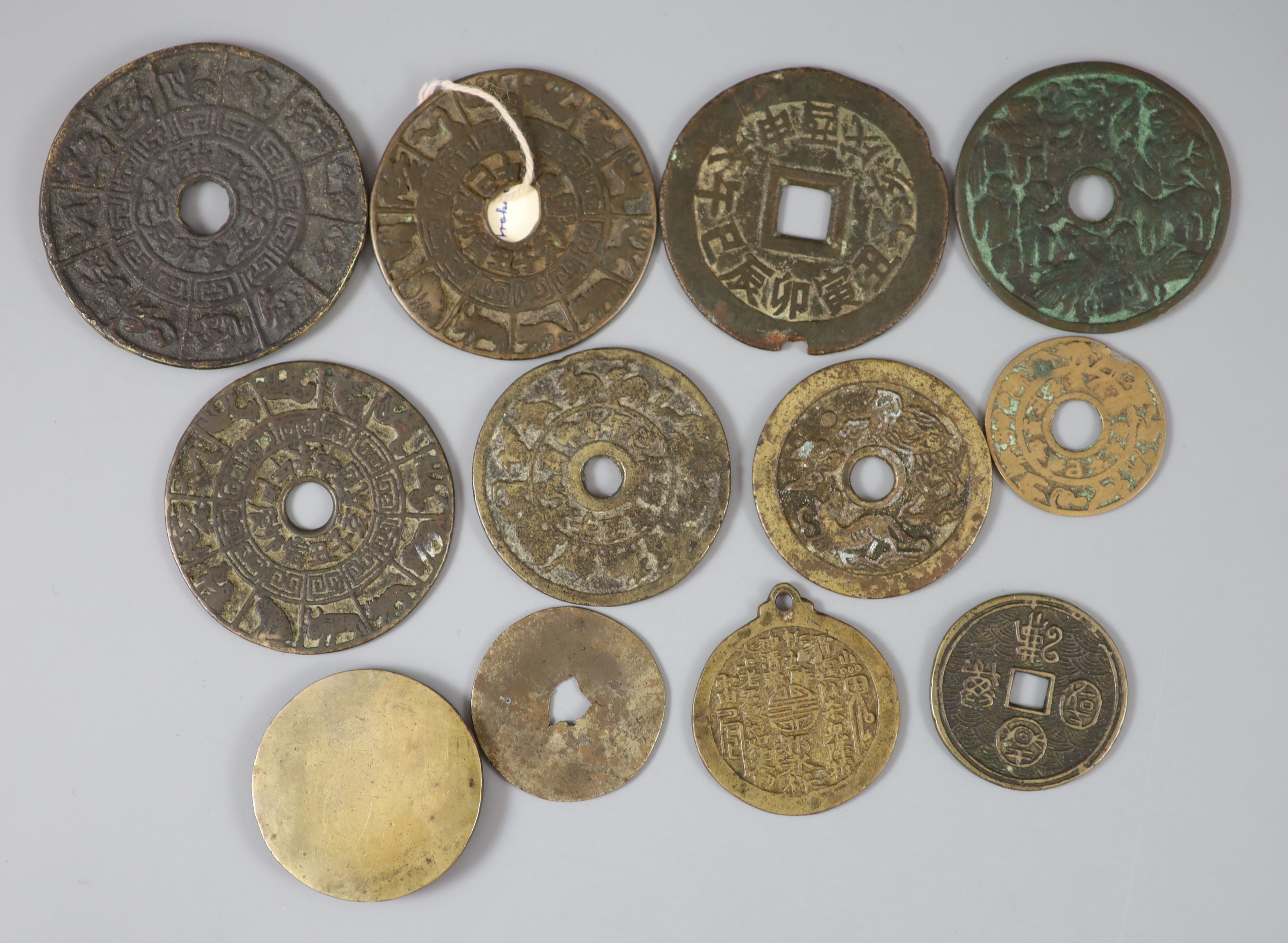 China, 12 bronze charms or amulets, Qing dynasty,